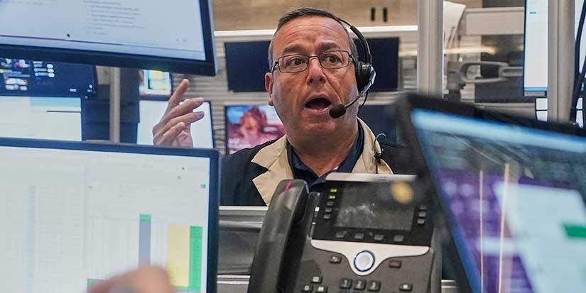 Stocks pull back from their latest all-time highs on Wall Street