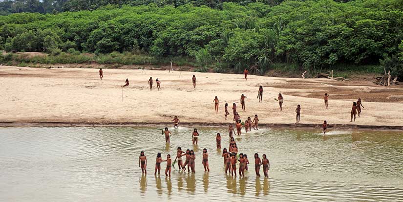 Group says photos of reclusive tribe on Peru beach show logging concessions are 'dangerously close'